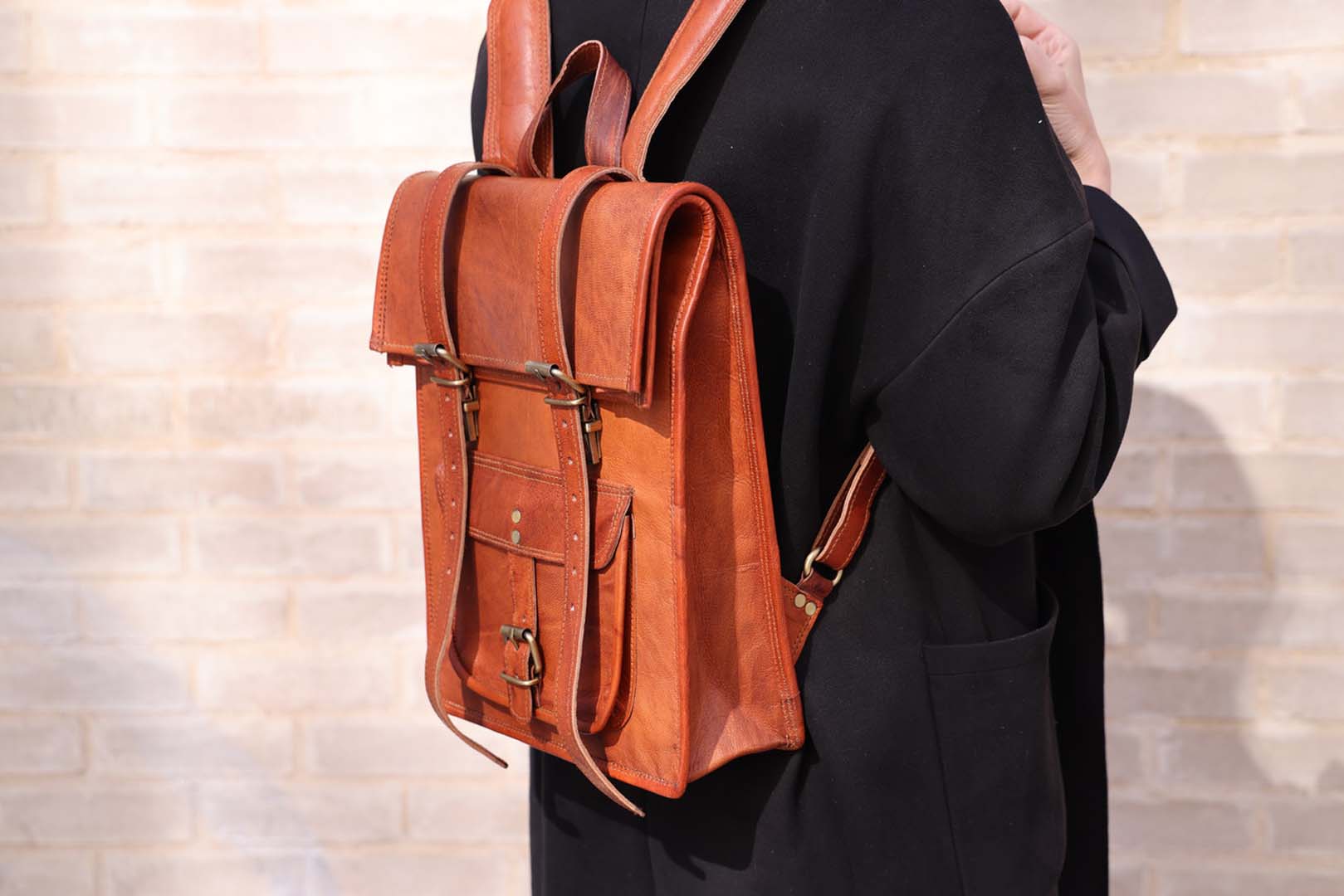 Leather 2 buckle roll top backpack