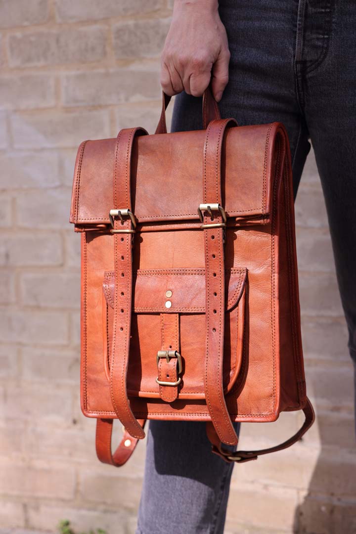 Leather 2 buckle roll top backpack